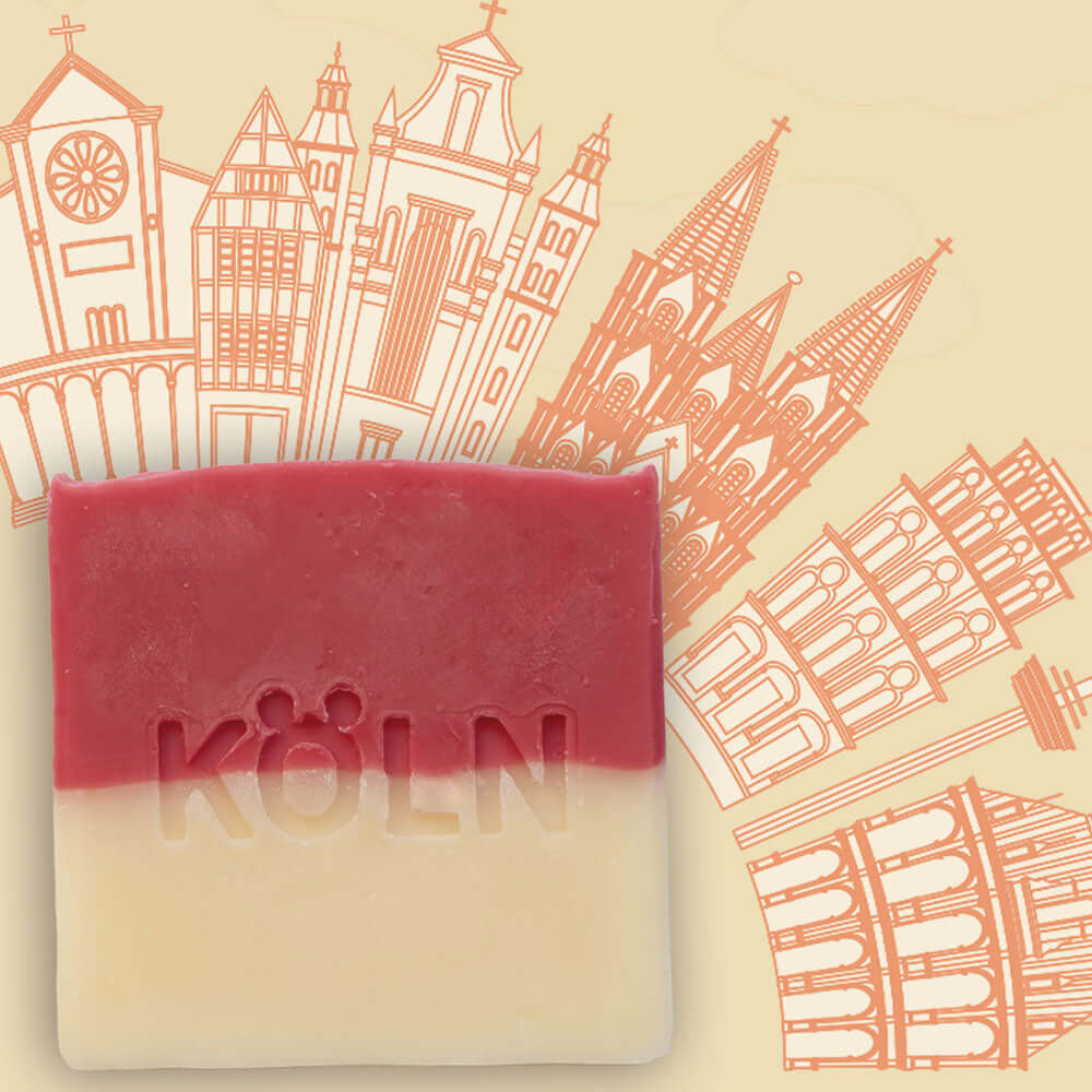 Handgemachte Bio Seife Köln mit Köln Deko im Hintergrund